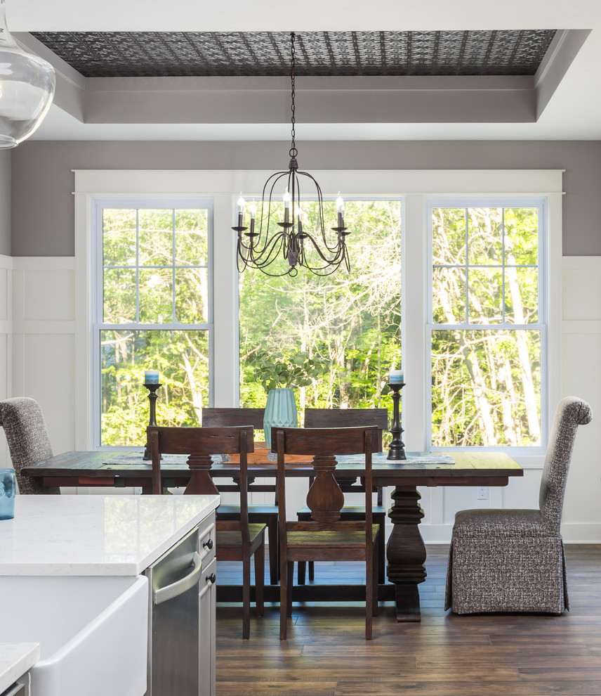 This is an example of a large rural kitchen/dining room in Grand Rapids with grey walls.