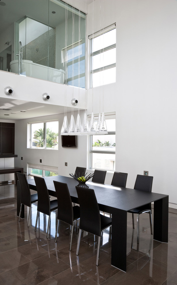 Inspiration for a large modern concrete floor great room remodel in Miami with white walls