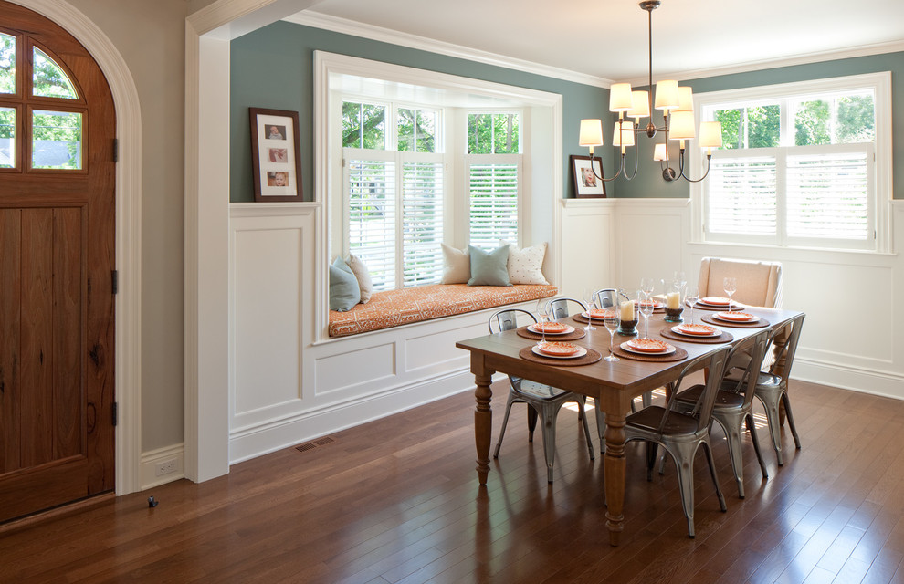 Elegant dark wood floor dining room photo in Grand Rapids with green walls