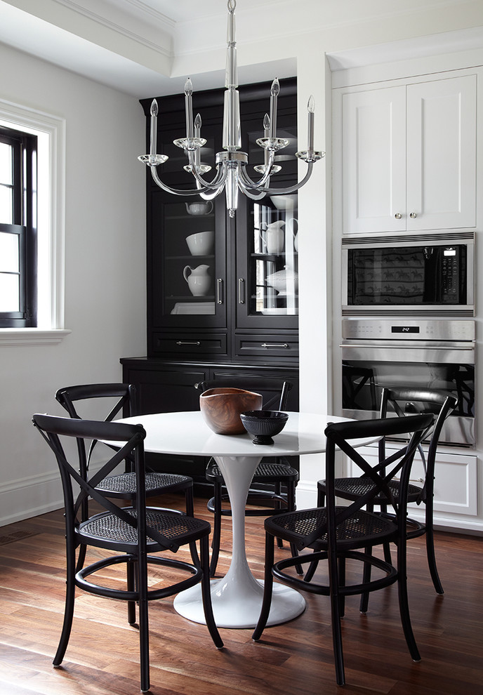 Example of a transitional dark wood floor kitchen/dining room combo design in Toronto with white walls
