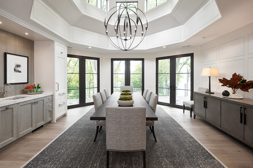 Enclosed dining room - transitional beige floor enclosed dining room idea in Grand Rapids with white walls