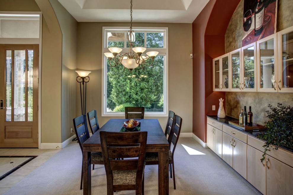 Traditional dining room in Seattle with carpet and beige walls.