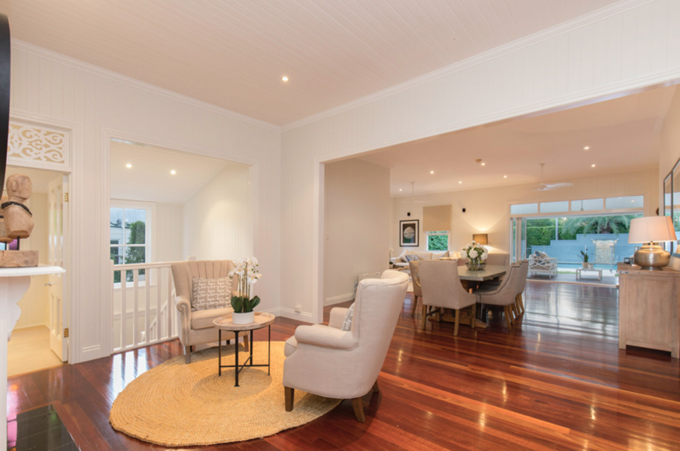 Design ideas for a traditional open plan dining room in Brisbane with white walls and dark hardwood flooring.