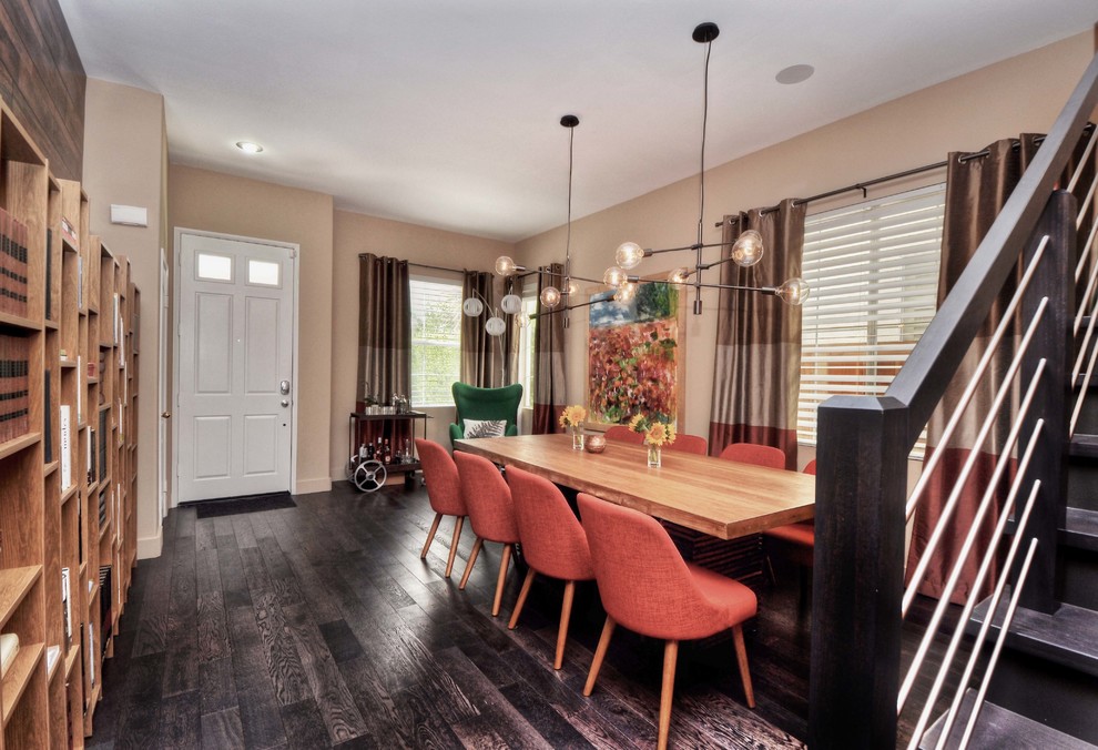 Enclosed dining room - contemporary dark wood floor enclosed dining room idea in Orange County with beige walls and no fireplace