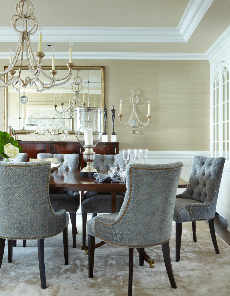 Example of a large transitional dark wood floor dining room design in New York with beige walls and no fireplace