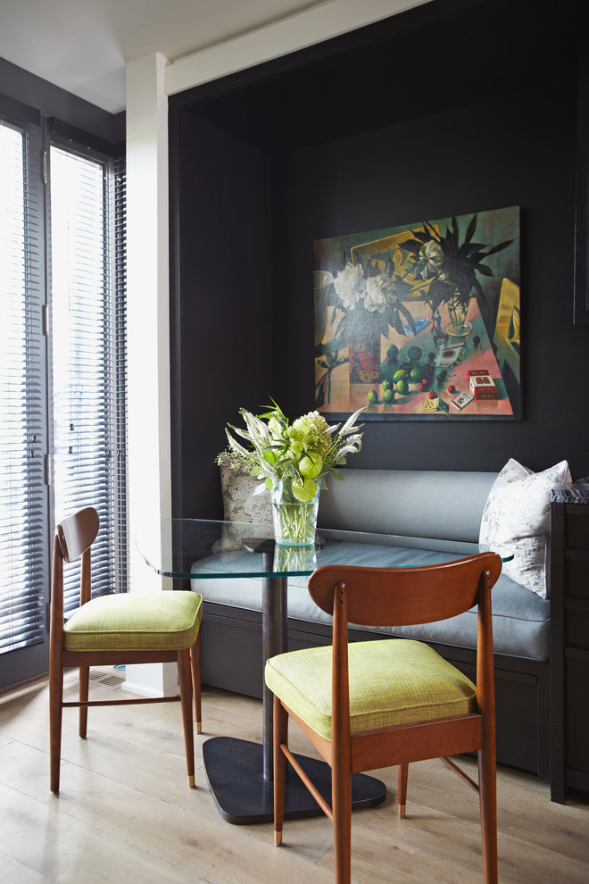 Inspiration for a contemporary dining room remodel in Toronto with black walls