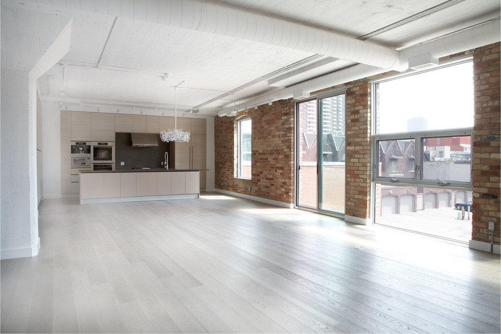 Huge trendy light wood floor kitchen/dining room combo photo in Toronto with white walls and no fireplace