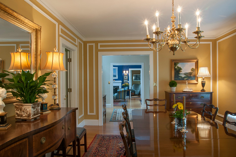 Example of a classic dining room design in Bridgeport with yellow walls