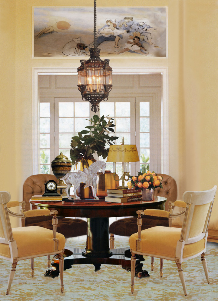 This is an example of a large classic enclosed dining room in Other with yellow walls and carpet.