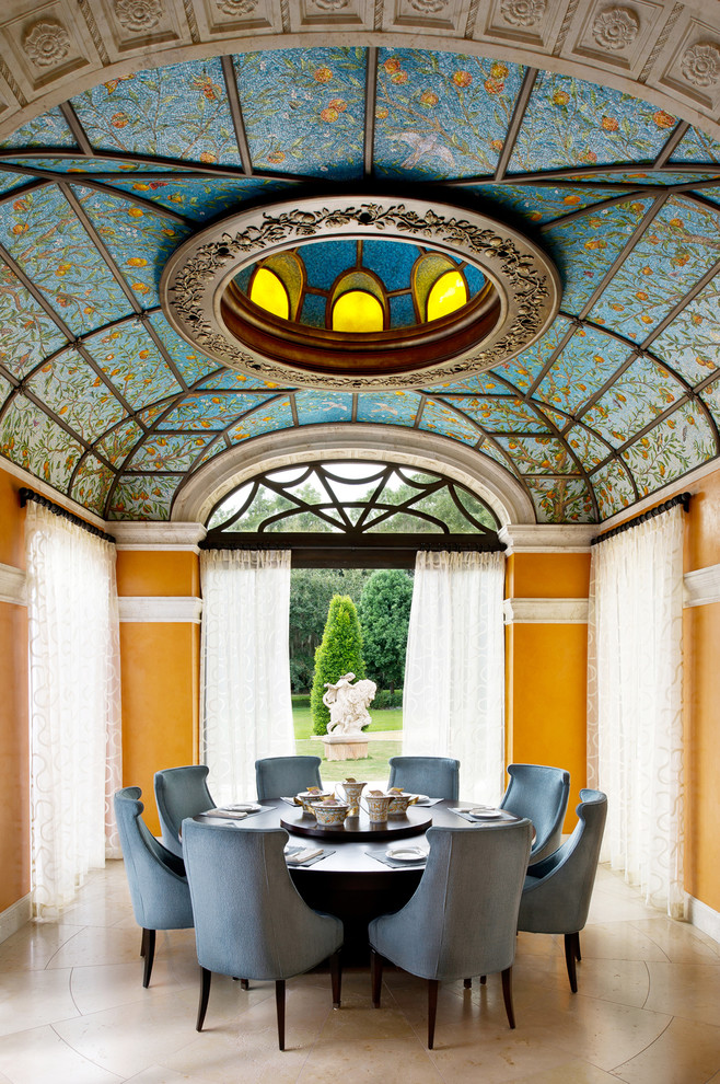 Inspiration for a traditional enclosed dining room in Orlando with no fireplace and yellow walls.