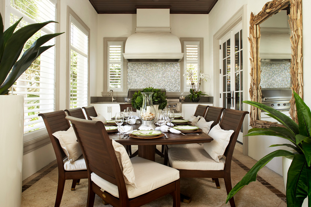 Dining room - traditional dining room idea in Miami with beige walls