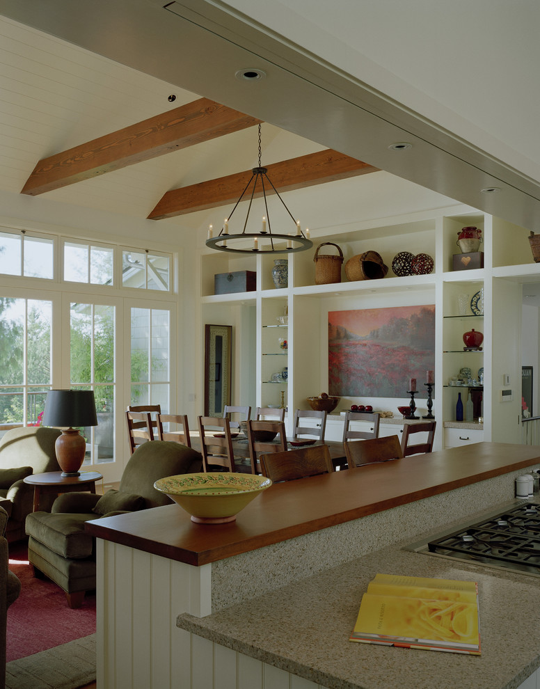 This is an example of a classic open plan dining room in Seattle with feature lighting.