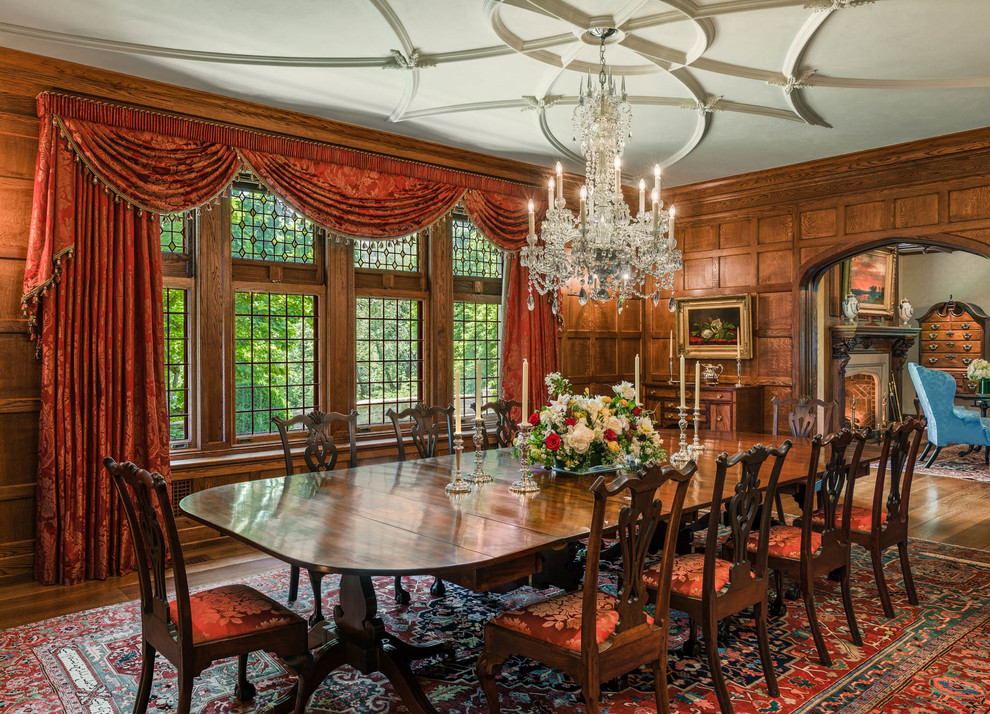 Elegant medium tone wood floor enclosed dining room photo in Philadelphia
