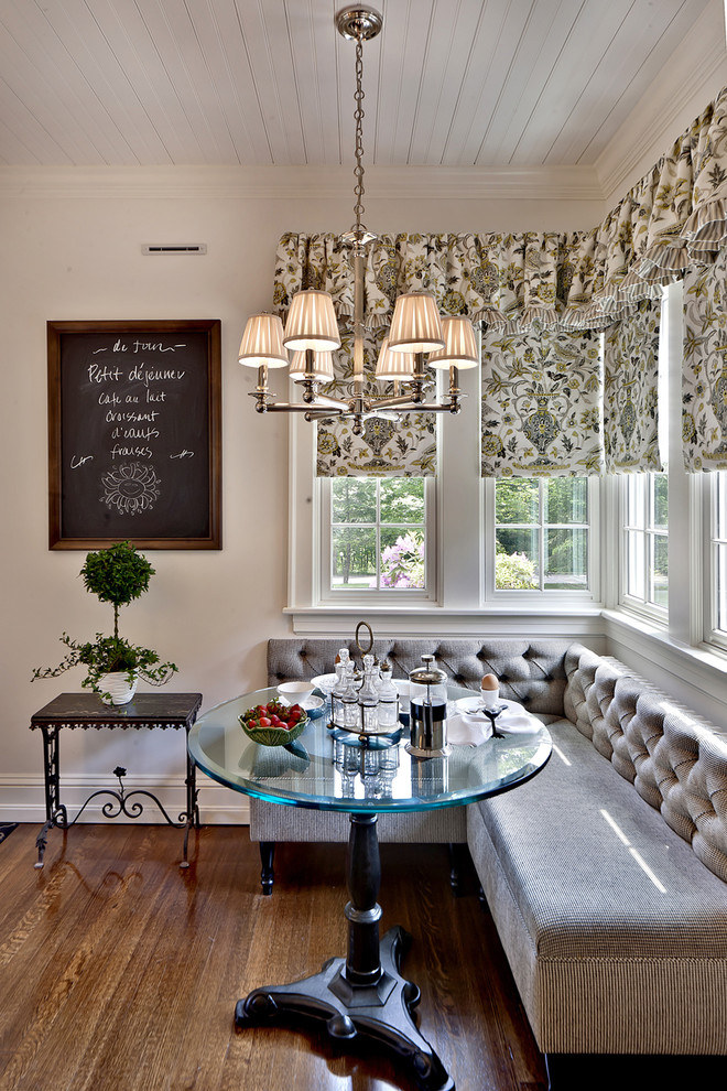Inspiration for a timeless dark wood floor and brown floor dining room remodel in Other with white walls