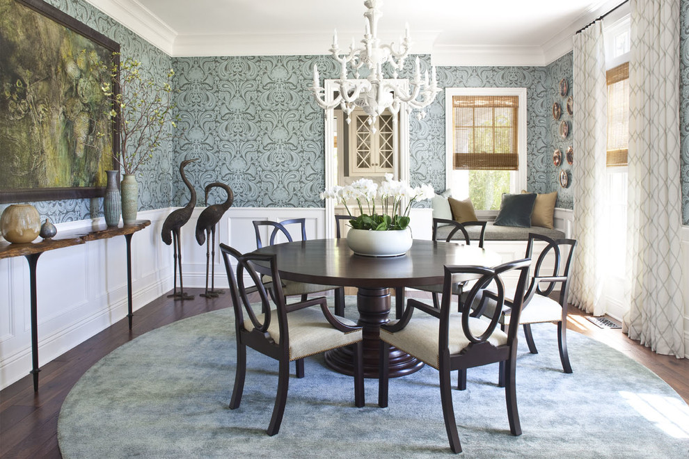 Ornate dark wood floor enclosed dining room photo in Los Angeles with blue walls