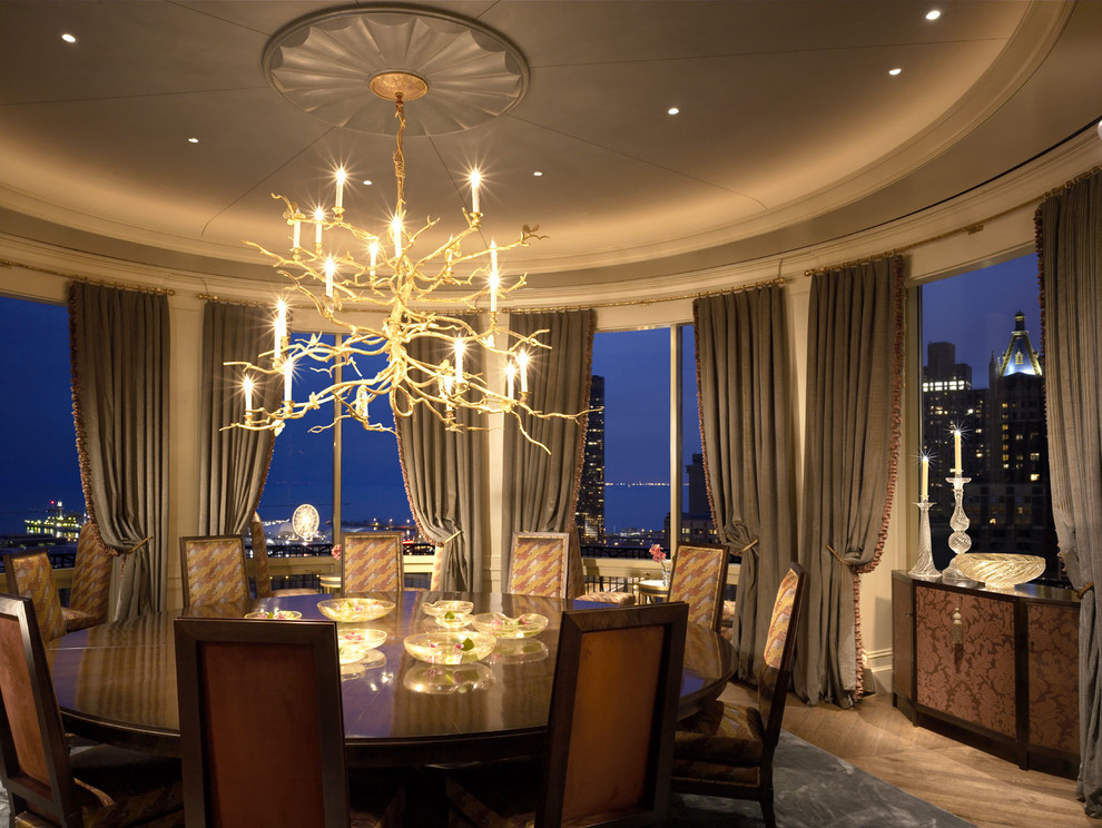 Example of a classic medium tone wood floor dining room design in Other