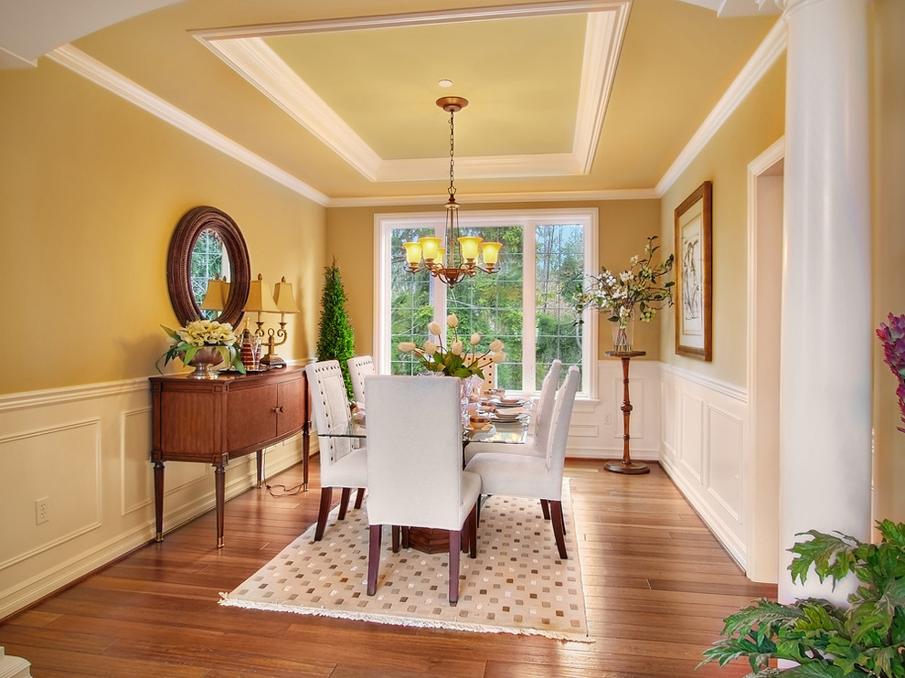 Inspiration for a timeless dining room remodel in Seattle with yellow walls