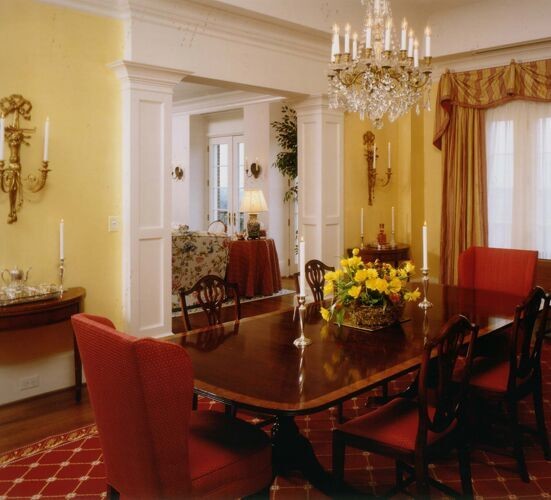 Example of a mid-sized classic dark wood floor enclosed dining room design in Atlanta with yellow walls and no fireplace