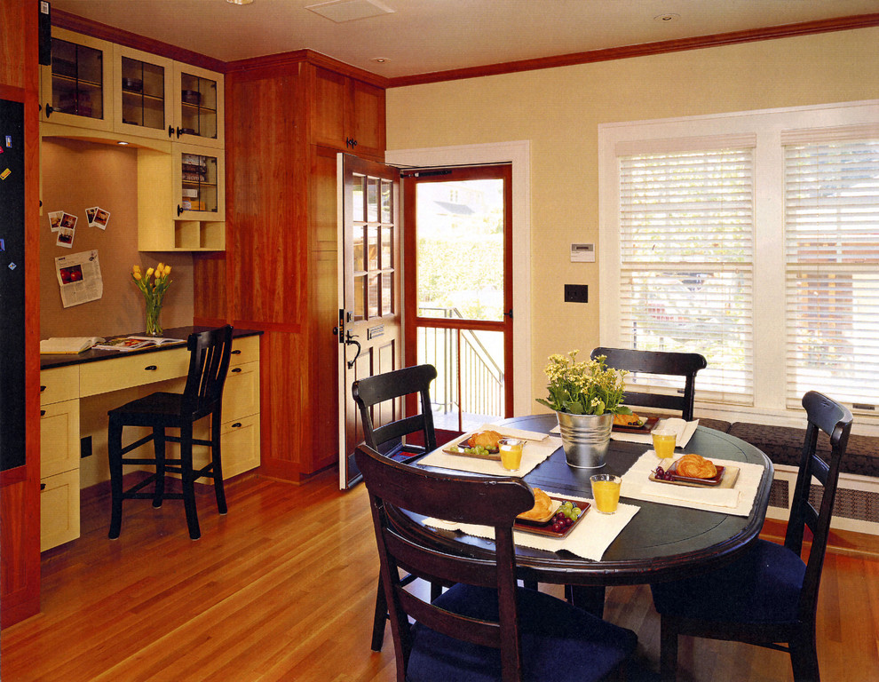Inspiration for a timeless medium tone wood floor dining room remodel in Seattle with beige walls