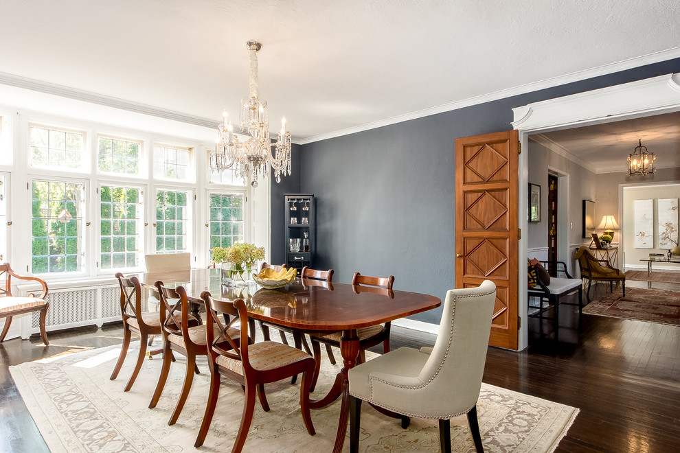 Inspiration for a traditional enclosed dining room in Columbus with grey walls and dark hardwood flooring.