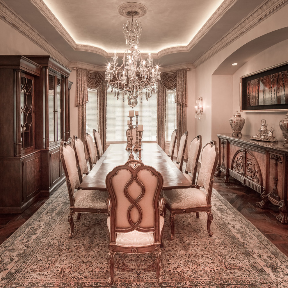 Inspiration for a timeless dark wood floor dining room remodel in Houston with beige walls