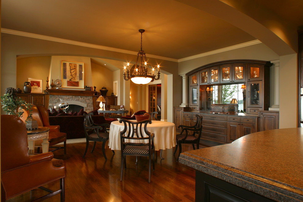 Mid-sized elegant dark wood floor and brown floor kitchen/dining room combo photo in Minneapolis with gray walls