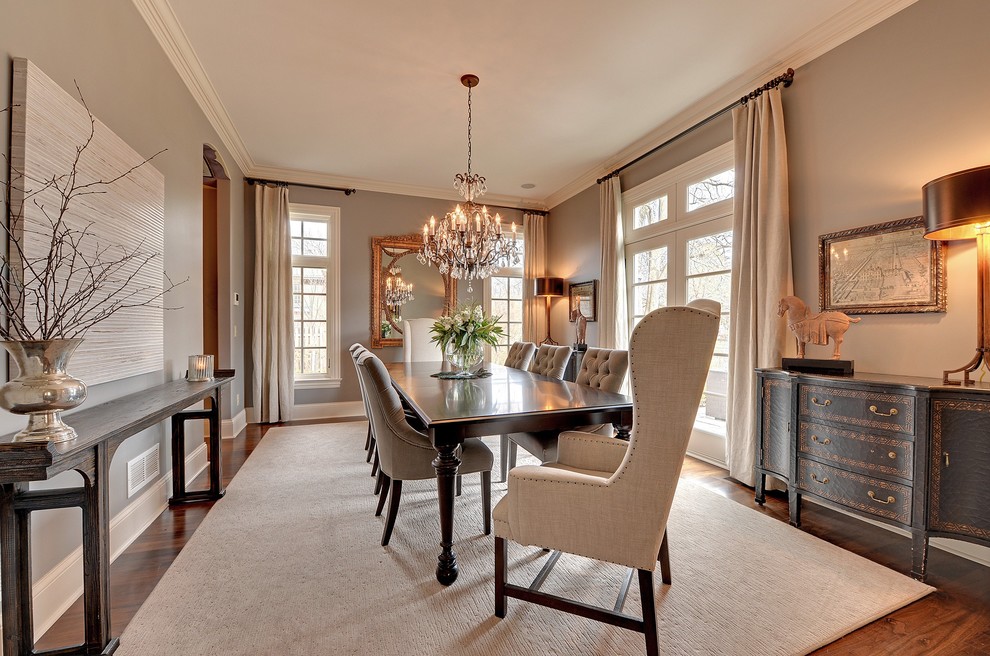 This is an example of a traditional dining room in Minneapolis with grey walls and beige floors.