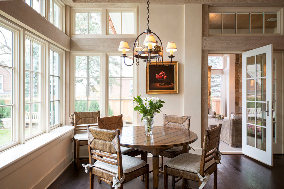 Design ideas for a traditional dining room in Minneapolis with beige walls and dark hardwood flooring.