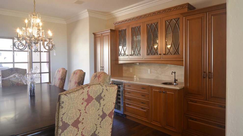 Large classic enclosed dining room in San Luis Obispo with beige walls, dark hardwood flooring and brown floors.