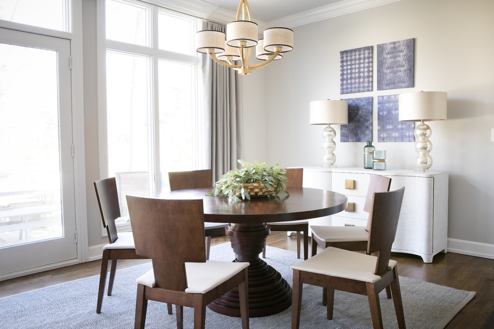 Inspiration for a classic dining room in Kansas City with grey walls, dark hardwood flooring and brown floors.