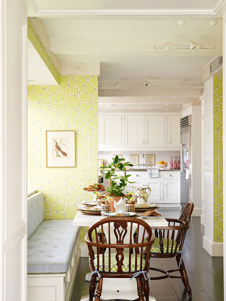 Example of a classic dark wood floor kitchen/dining room combo design in New York