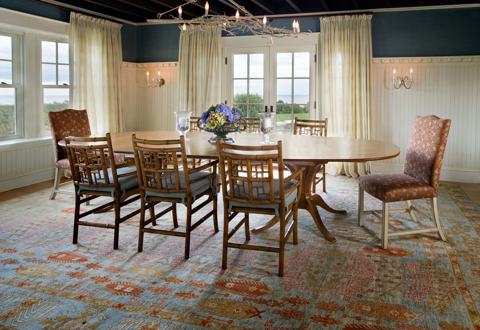 Large elegant medium tone wood floor enclosed dining room photo in Boston with blue walls and no fireplace