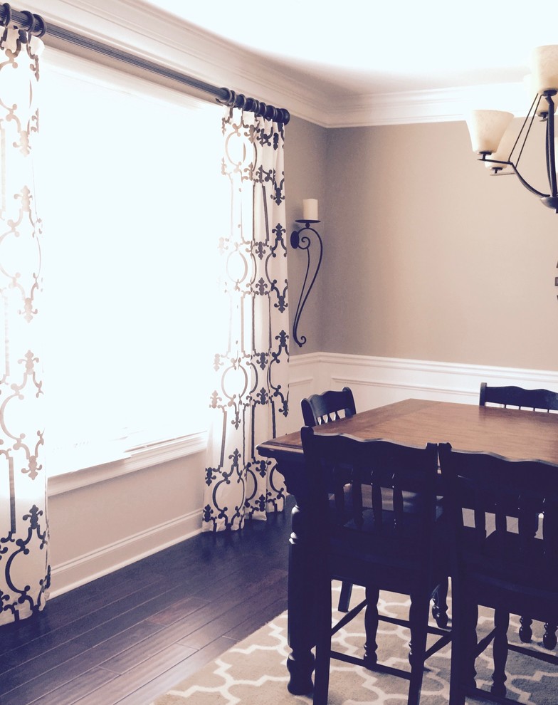 Elegant dark wood floor dining room photo in Atlanta with brown walls