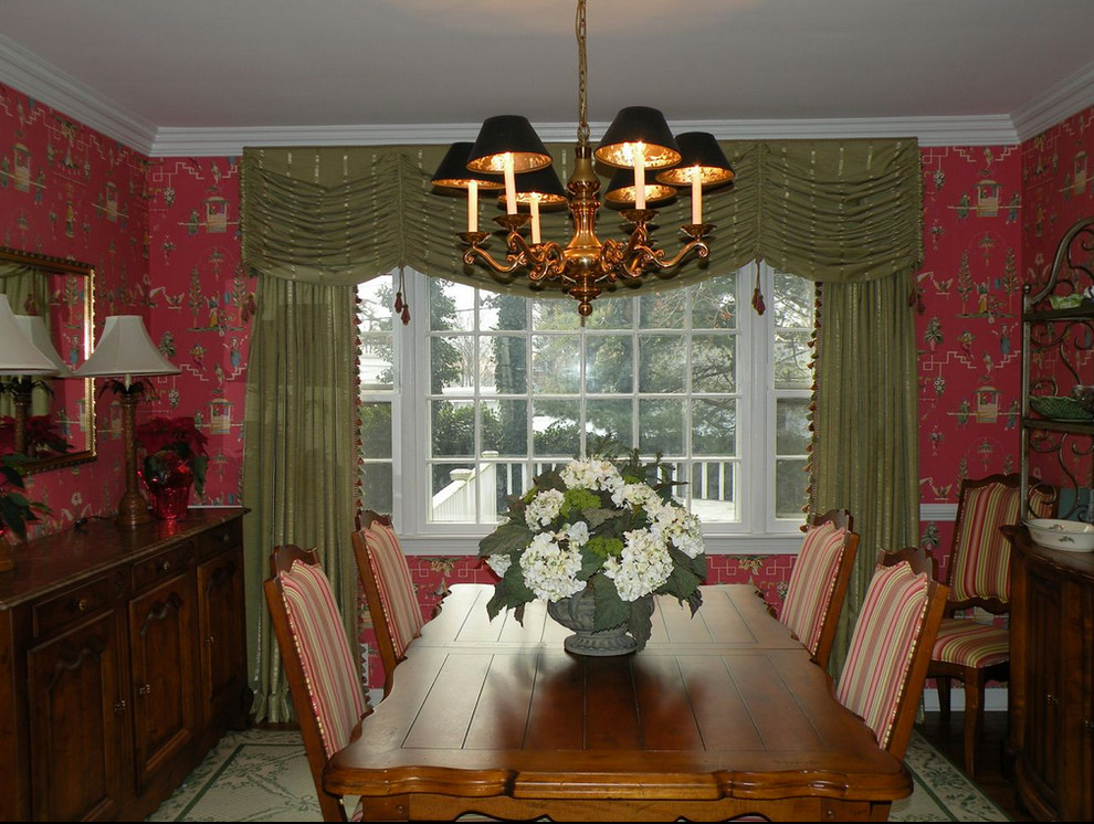 Photo of a classic enclosed dining room in New York with red walls.