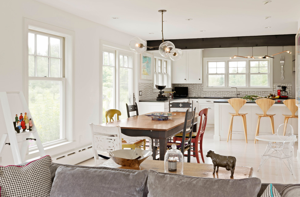 Bohemian open plan dining room in Burlington with white walls, light hardwood flooring and beige floors.