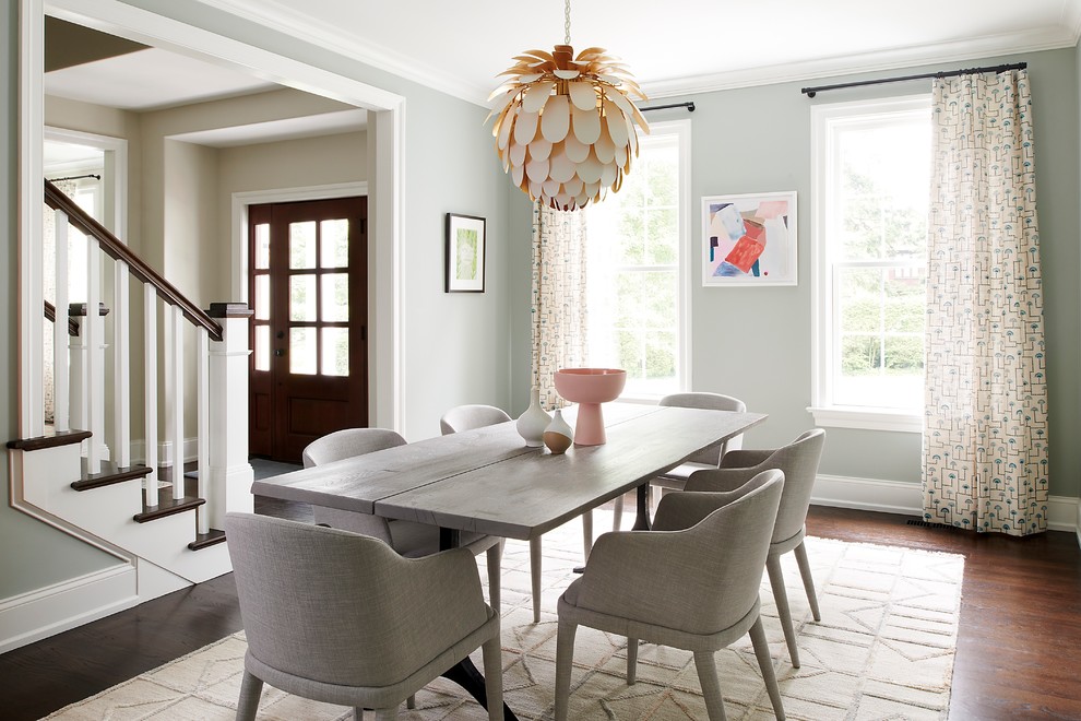 This is an example of a classic dining room in Philadelphia with grey walls, medium hardwood flooring and brown floors.