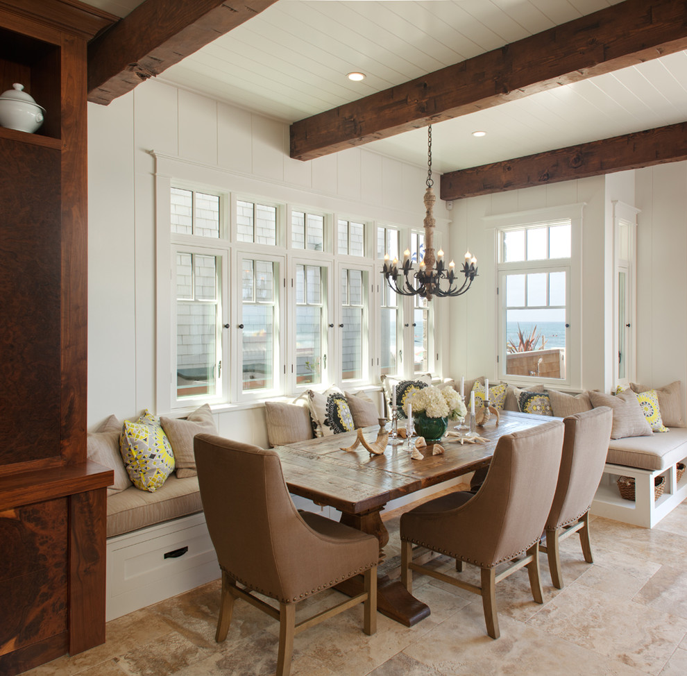 Example of a beach style dining room design in San Diego with white walls
