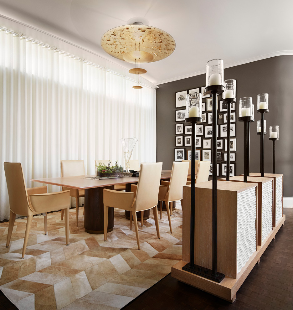 Photo of a traditional dining room in Chicago with grey walls.