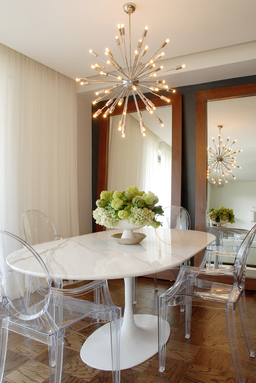 Dining room - transitional medium tone wood floor dining room idea in Los Angeles with beige walls || Tips For Decorating A Dining Room On A Small Budget