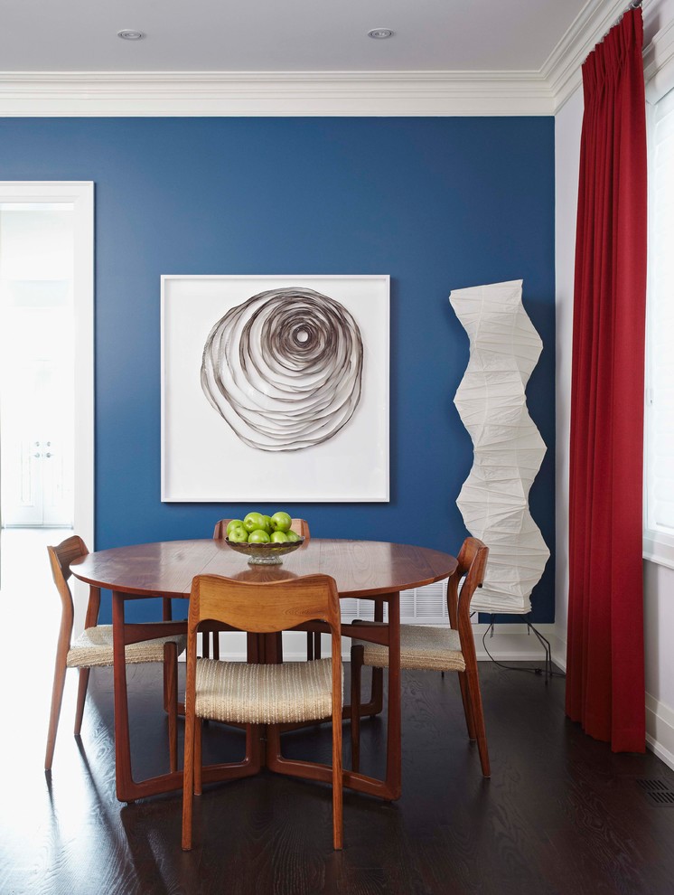 Inspiration for a transitional dark wood floor dining room remodel in Toronto with blue walls