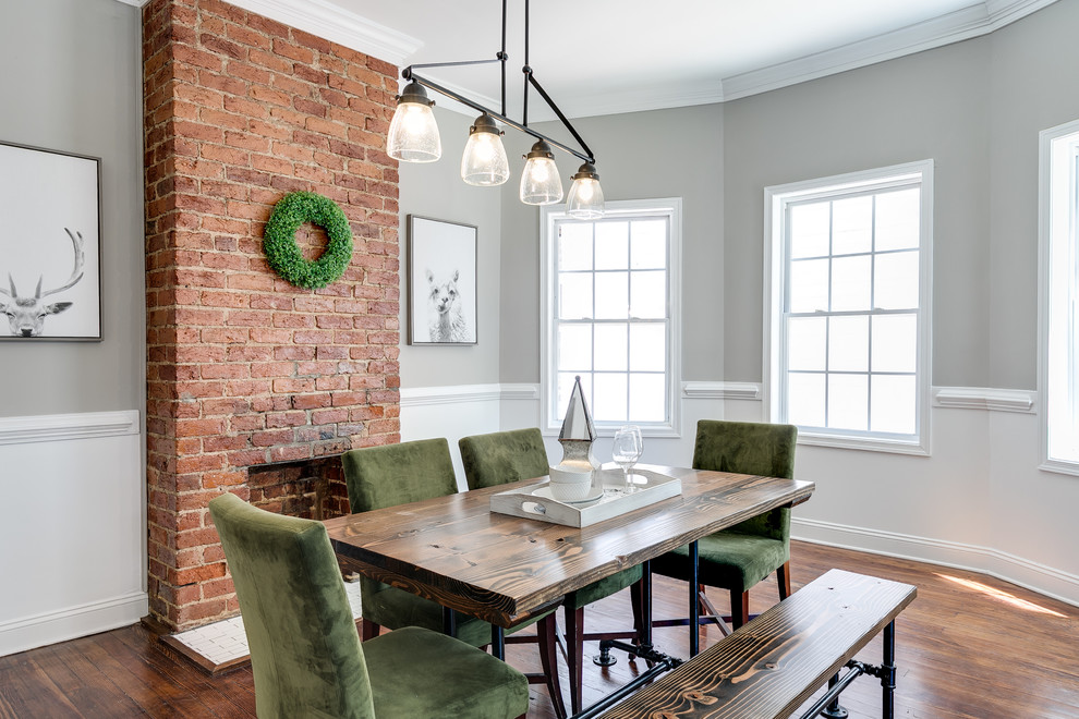 Traditional dining room in Richmond with grey walls, medium hardwood flooring, a standard fireplace and a brick fireplace surround.