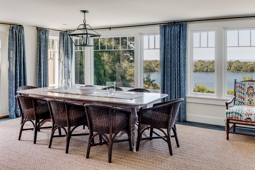 Photo of a large beach style dining room in Boston with white walls and no fireplace.
