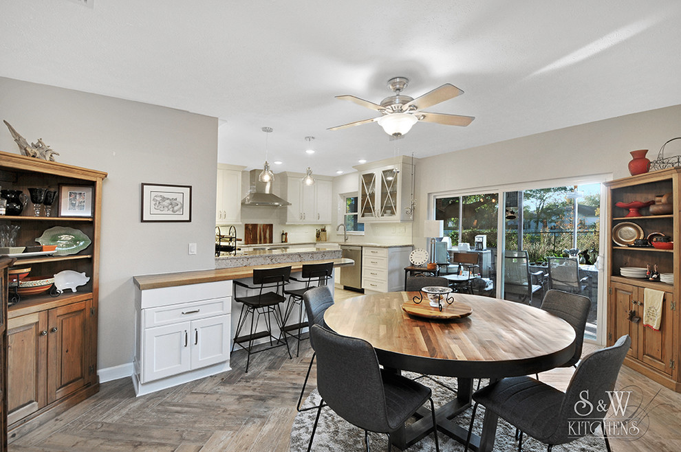 Photo of a medium sized classic kitchen/dining room in Tampa with grey walls, porcelain flooring and grey floors.