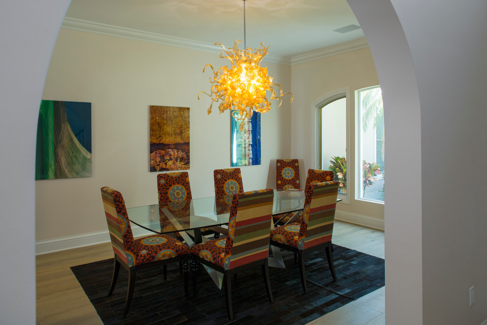 Inspiration for a medium sized traditional enclosed dining room in Tampa with beige walls, light hardwood flooring, no fireplace and brown floors.