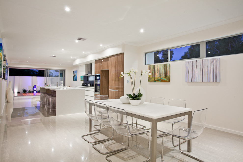 This is an example of a contemporary kitchen/dining room in Perth with white walls.