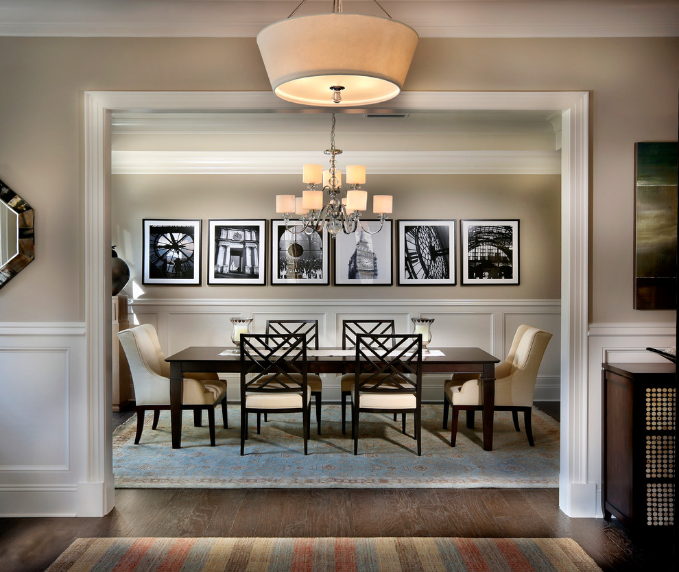 Design ideas for a large classic dining room in Charlotte with beige walls and dark hardwood flooring.