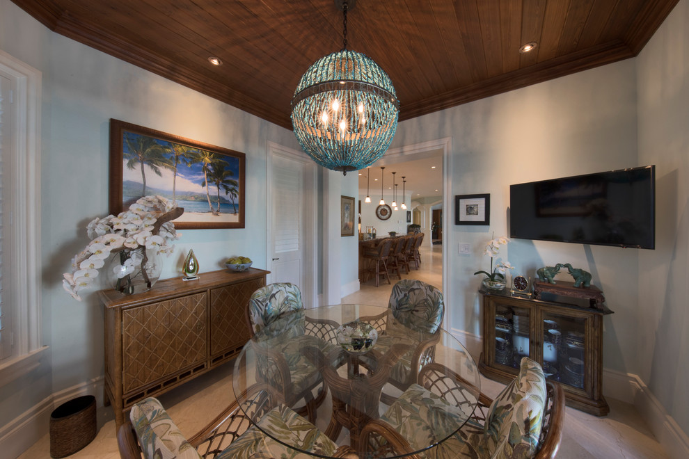 Enclosed dining room - huge tropical beige floor enclosed dining room idea in Miami with blue walls