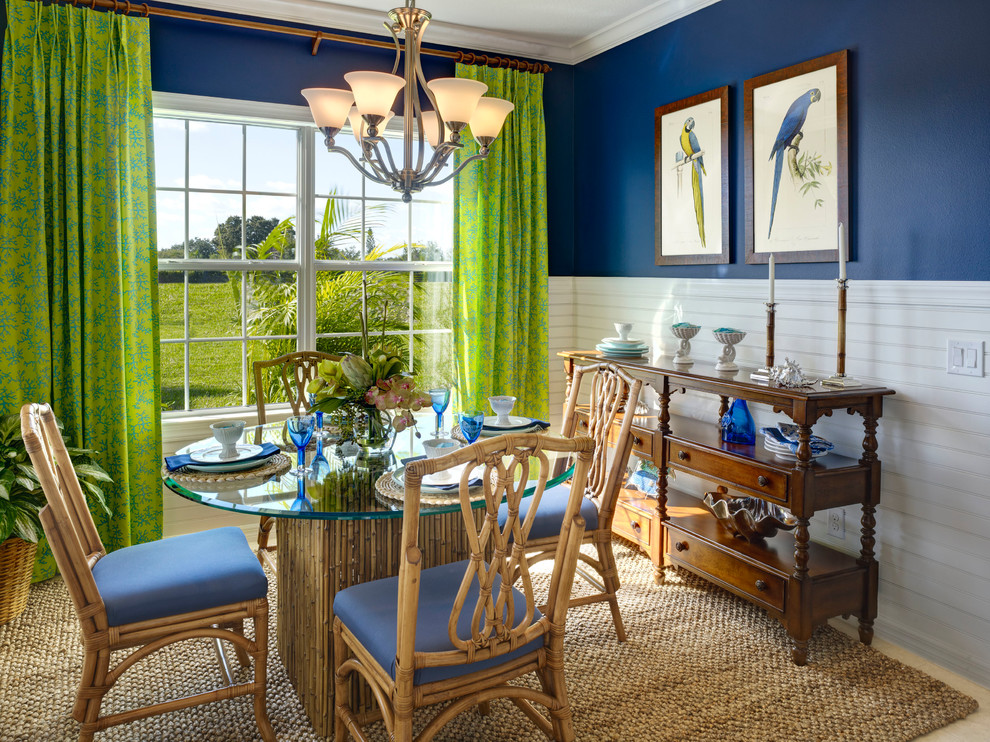 Dining room - tropical dining room idea in Tampa with blue walls