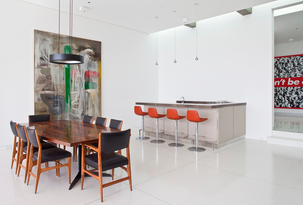 Contemporary dining room in Los Angeles with white walls.