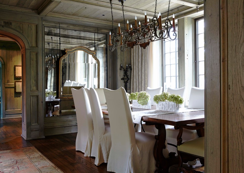 Photo of a traditional dining room in Birmingham with dark hardwood flooring and brown floors.
